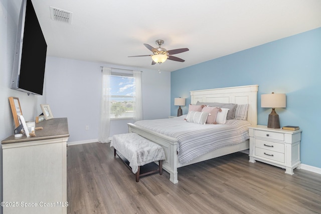2039 Snapdragon Dr NW, Palm Bay, FL 32907 - bedroom with dark wood-type flooring, baseboards, and ceiling fan