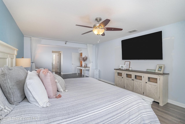 2039 Snapdragon Dr NW, Palm Bay, FL 32907 - bedroom featuring dark wood-style floors, baseboards, and ceiling fan