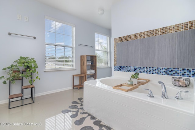 2039 Snapdragon Dr NW, Palm Bay, FL 32907 - bathroom with a garden tub and baseboards