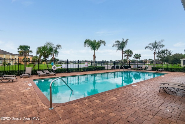 2039 Snapdragon Dr NW, Palm Bay, FL 32907 - community pool featuring a patio area