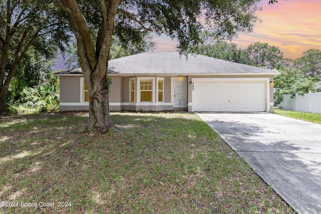 260 Hinchman St SE, Palm Bay, FL 32909 - ranch-style home featuring an attached garage, concrete driveway, and stucco siding