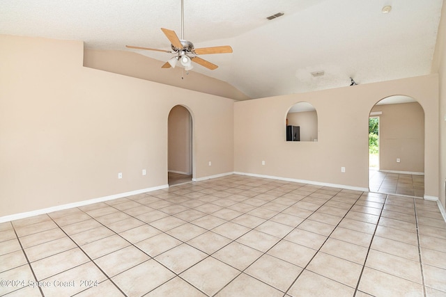 260 Hinchman St SE, Palm Bay, FL 32909 - unfurnished room with arched walkways, ceiling fan, light tile patterned floors, and lofted ceiling