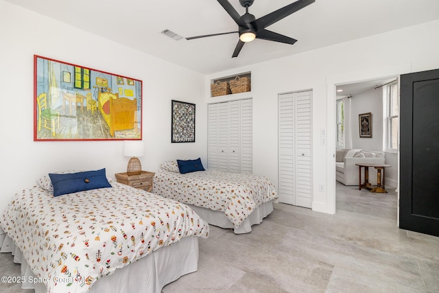 333 N Atlantic Ave Unit 333, Cocoa Beach, FL 32931 - bedroom featuring two closets and a ceiling fan