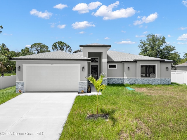 337 Fifer St SE, Palm Bay, FL 32909 - prairie-style home featuring stone siding, a garage, and stucco siding