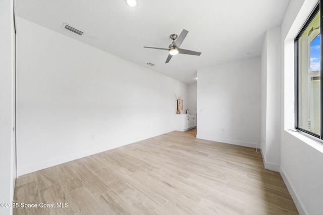 337 Fifer St SE, Palm Bay, FL 32909 - unfurnished room featuring light wood-type flooring and ceiling fan