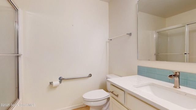 2178 Redwood Cir NE, Palm Bay, FL 32905 - full bath featuring toilet, vanity, a shower with shower door, decorative backsplash, and tile patterned flooring