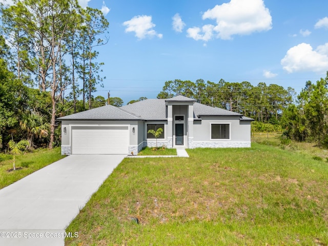 531 Higgs Ave NW, Palm Bay, FL 32907 - view of front of house with a garage, stone siding, a front yard, and driveway
