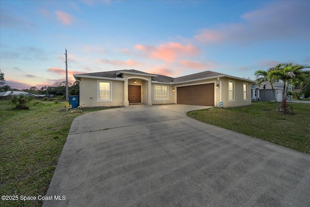 386 Sarah Rd SW, Palm Bay, FL 32908 - single story home featuring driveway, a garage, a yard, and stucco siding