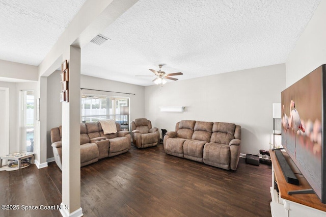 1236 Foxridge Pl, Melbourne, FL 32940 - living room with a textured ceiling, a ceiling fan, and dark wood-style floors