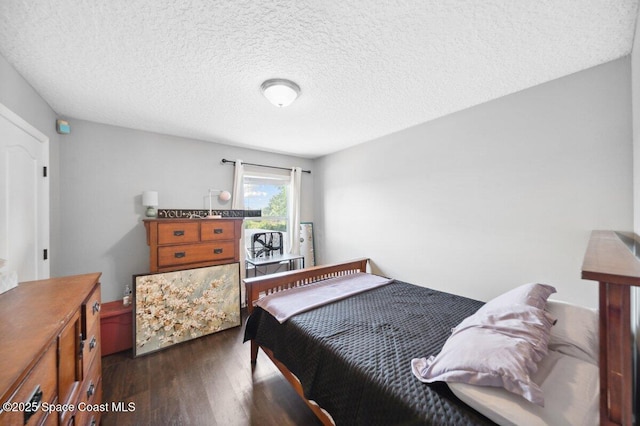 1236 Foxridge Pl, Melbourne, FL 32940 - bedroom with dark wood-style floors and a textured ceiling