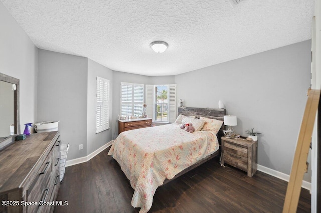 1236 Foxridge Pl, Melbourne, FL 32940 - bedroom featuring dark wood finished floors and a textured ceiling