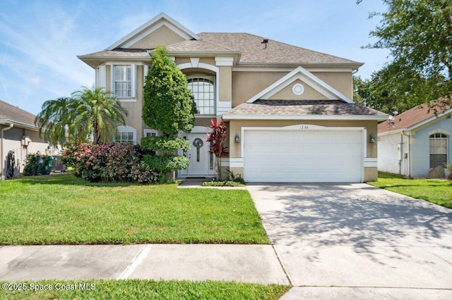 1236 Foxridge Pl, Melbourne, FL 32940 - view of front of property featuring stucco siding, driveway, a front lawn, a garage, and roof with shingles