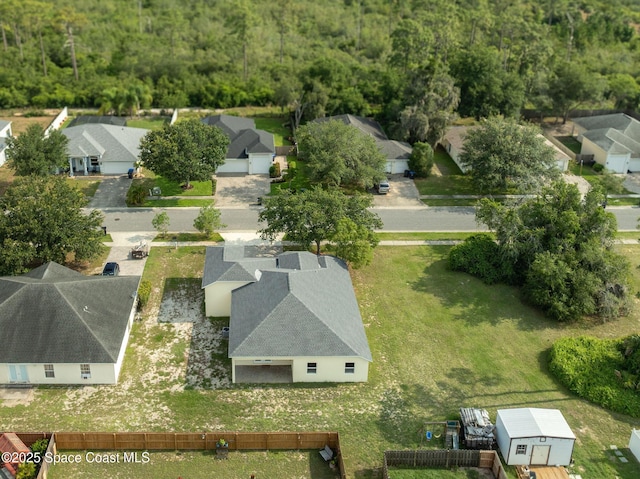 3977 Foothill Dr, Titusville, FL 32796 - aerial perspective of suburban area featuring a heavily wooded area