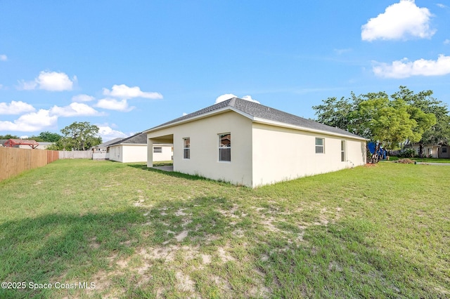 3977 Foothill Dr, Titusville, FL 32796 - rear view of house with stucco siding