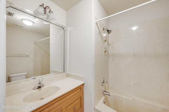3977 Foothill Dr, Titusville, FL 32796 - bathroom with tub / shower combination, toilet, vanity, and a textured ceiling
