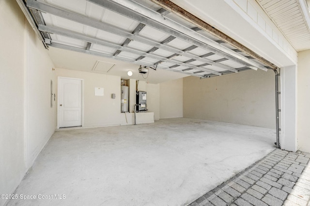 3977 Foothill Dr, Titusville, FL 32796 - garage with electric water heater, a garage door opener, and heating unit