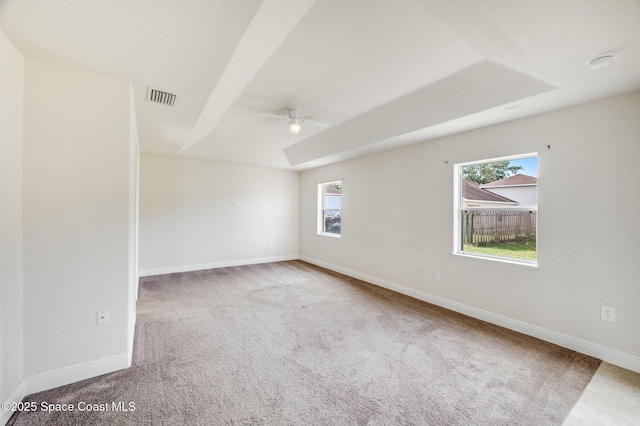 3977 Foothill Dr, Titusville, FL 32796 - carpeted empty room featuring a ceiling fan, plenty of natural light, baseboards, and a smoke detector