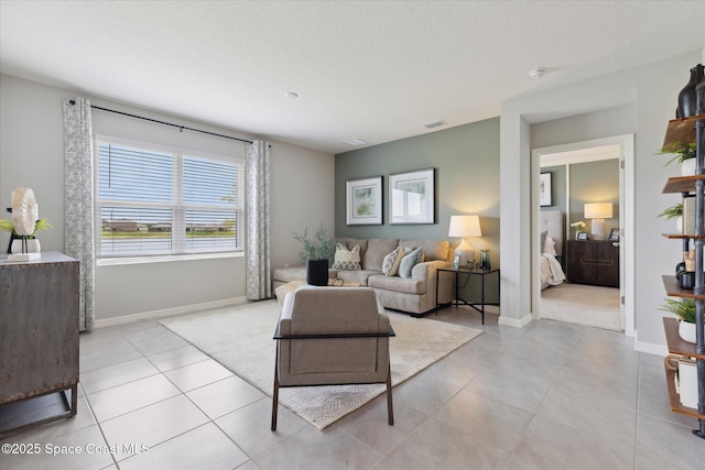 1103 Dunes Ave, Melbourne, FL 32904 - living area featuring light tile patterned floors and baseboards
