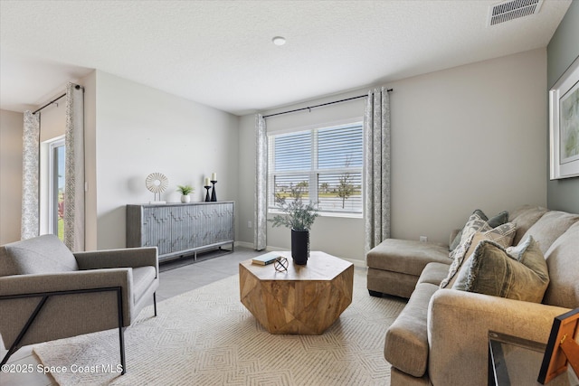 1103 Dunes Ave, Melbourne, FL 32904 - living room with light tile patterned flooring