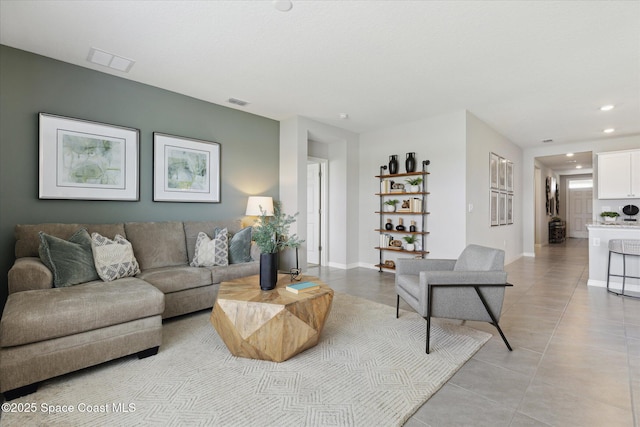 1103 Dunes Ave, Melbourne, FL 32904 - living room with light tile patterned floors and recessed lighting