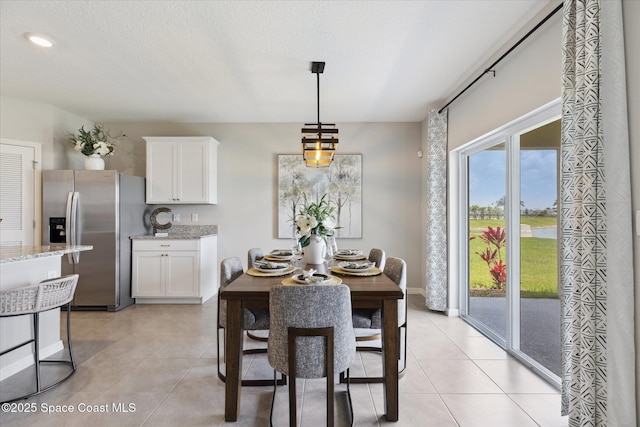 1103 Dunes Ave, Melbourne, FL 32904 - dining space featuring light tile patterned floors and recessed lighting