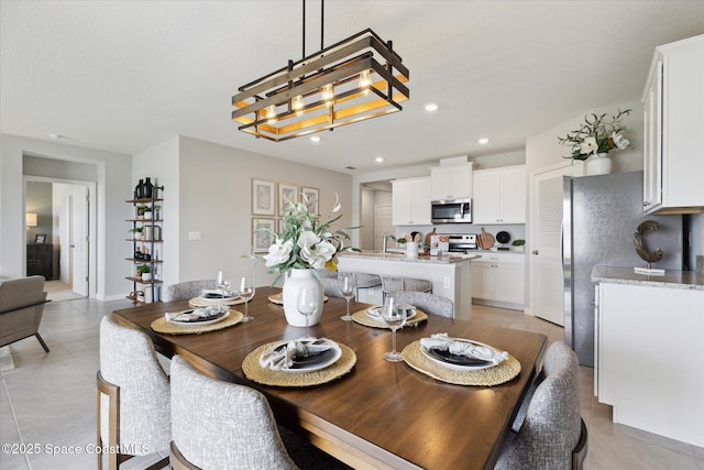 1103 Dunes Ave, Melbourne, FL 32904 - dining room featuring recessed lighting and light tile patterned floors
