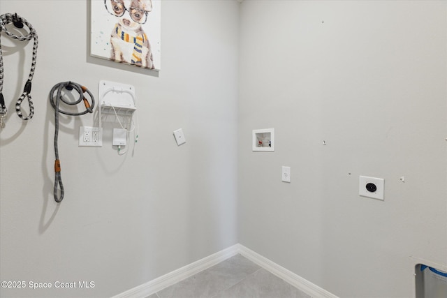 1103 Dunes Ave, Melbourne, FL 32904 - washroom featuring hookup for a washing machine, electric dryer hookup, and light tile patterned flooring