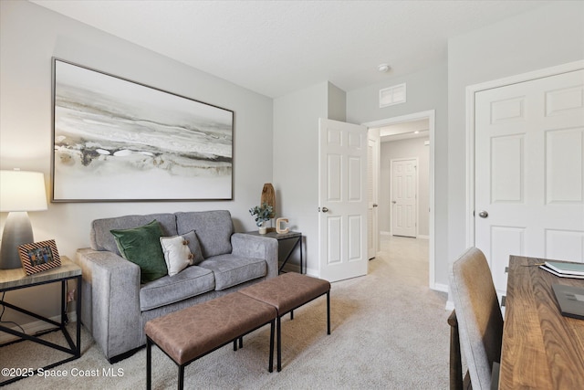 1103 Dunes Ave, Melbourne, FL 32904 - living area featuring light colored carpet and baseboards