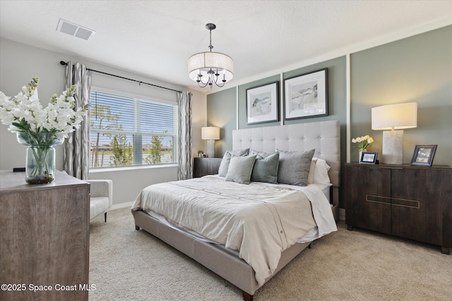 1103 Dunes Ave, Melbourne, FL 32904 - carpeted bedroom featuring a chandelier and baseboards