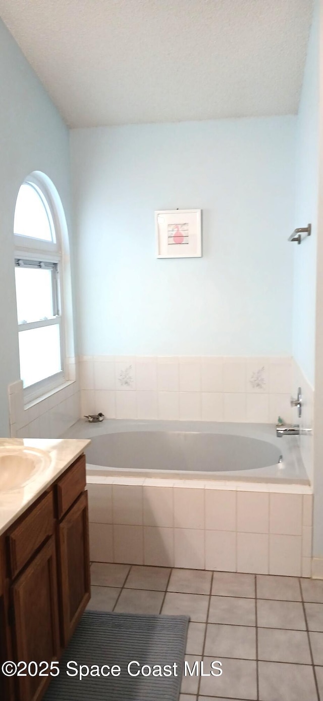 1796 Lambton St NW, Palm Bay, FL 32907 - bathroom with a bath, vanity, and tile patterned floors