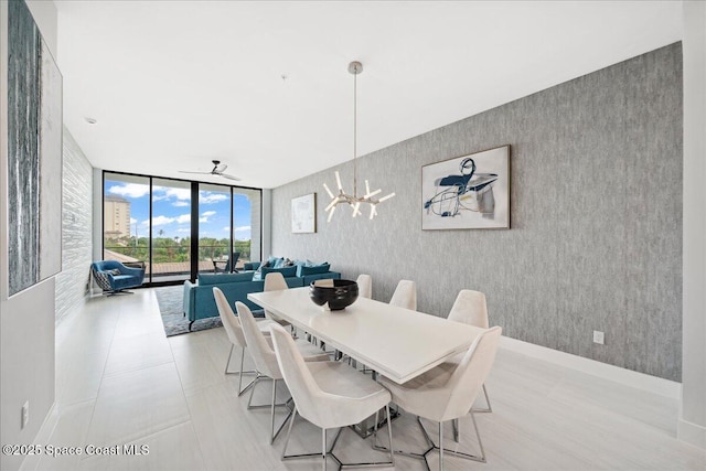 3031 Hafen Ln Unit 306, Melbourne Beach, FL 32951 - dining room with floor to ceiling windows and wallpapered walls
