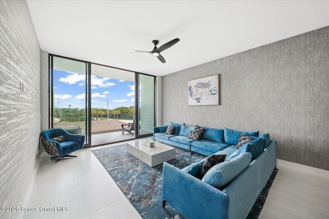 3031 Hafen Ln Unit 306, Melbourne Beach, FL 32951 - living room with expansive windows and ceiling fan
