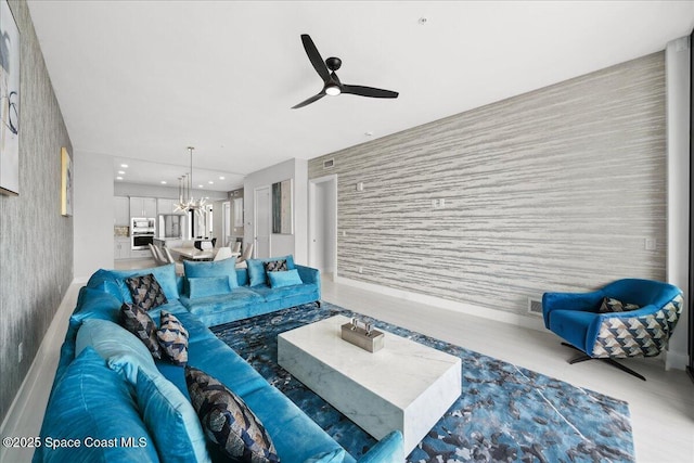 3031 Hafen Ln Unit 306, Melbourne Beach, FL 32951 - living area featuring an accent wall, wallpapered walls, a ceiling fan, recessed lighting, and a chandelier