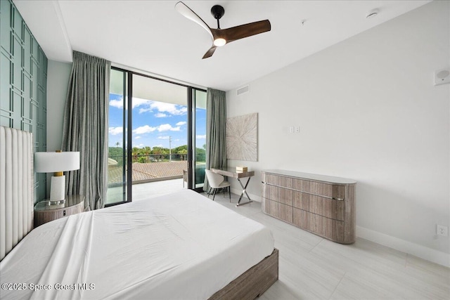 3031 Hafen Ln Unit 306, Melbourne Beach, FL 32951 - bedroom featuring access to outside, expansive windows, ceiling fan, and light tile patterned floors