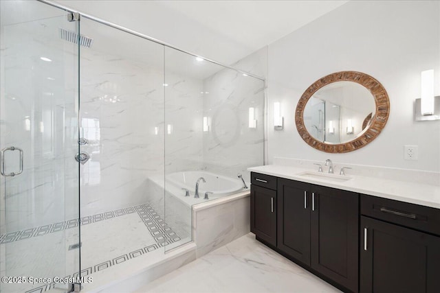 3031 Hafen Ln Unit 306, Melbourne Beach, FL 32951 - bathroom with vanity, a garden tub, a marble finish shower, and marble finish floors