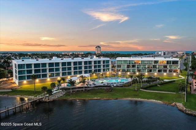 3031 Hafen Ln Unit 306, Melbourne Beach, FL 32951 - aerial view at dusk of view of pool area and a water view