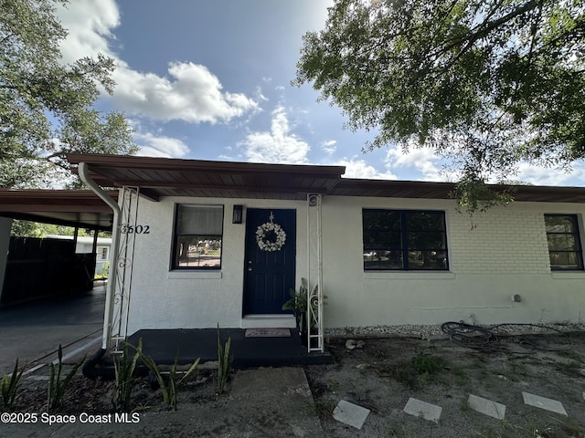 1602 Harvard Dr, Cocoa, FL 32922 - view of front of house with a carport and stucco siding