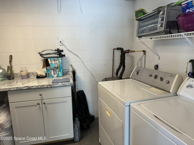 1602 Harvard Dr, Cocoa, FL 32922 - laundry area with independent washer and dryer, cabinet space, and concrete block wall