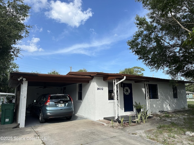 1602 Harvard Dr, Cocoa, FL 32922 - single story home featuring driveway, an attached carport, and stucco siding