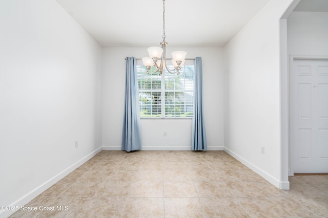 3485 Sansome Cir, Melbourne, FL 32940 - empty room featuring a chandelier, light tile patterned floors, and arched walkways