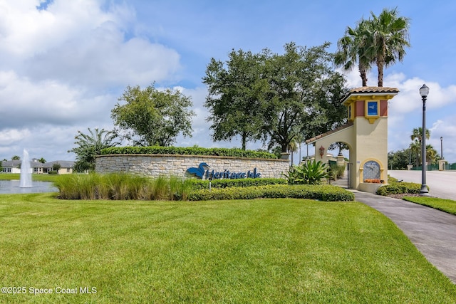 3485 Sansome Cir, Melbourne, FL 32940 - community sign featuring a yard and a water view