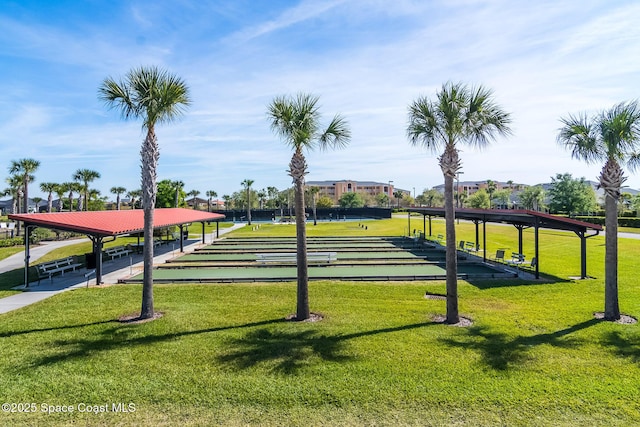 3485 Sansome Cir, Melbourne, FL 32940 - surrounding community with a game area and a lawn
