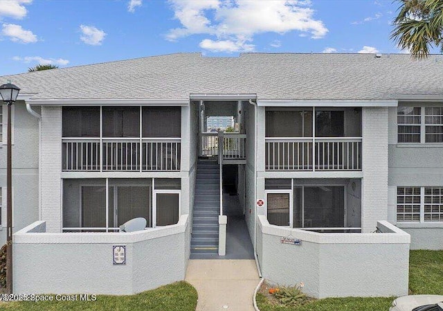 933 Sonesta Ave NE Unit 208, Palm Bay, FL 32905 - view of building exterior with stairway