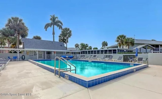 933 Sonesta Ave NE Unit 208, Palm Bay, FL 32905 - community pool with a patio area
