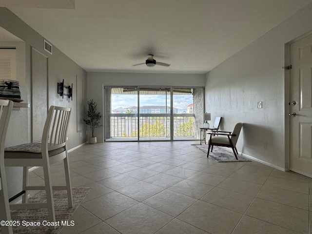933 Sonesta Ave NE Unit 208, Palm Bay, FL 32905 - living area with tile patterned flooring and a ceiling fan