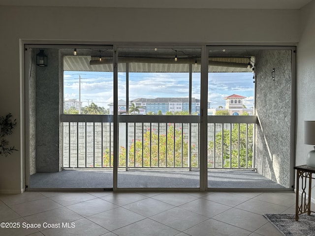 933 Sonesta Ave NE Unit 208, Palm Bay, FL 32905 - doorway to outside with tile patterned floors