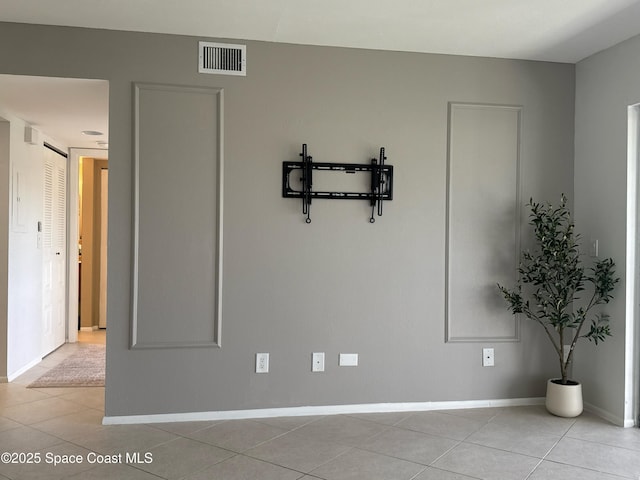 933 Sonesta Ave NE Unit 208, Palm Bay, FL 32905 - unfurnished room with light tile patterned floors and baseboards