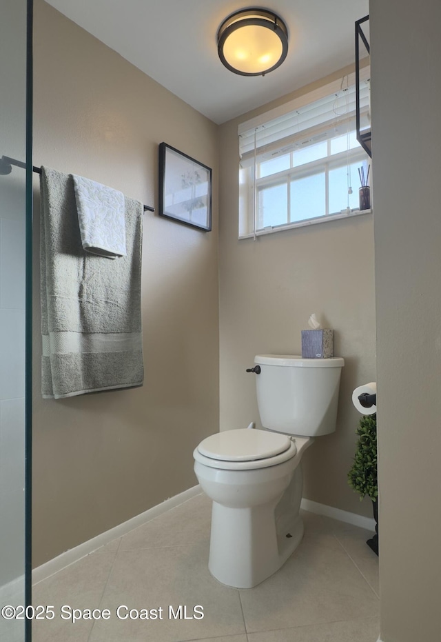933 Sonesta Ave NE Unit 208, Palm Bay, FL 32905 - bathroom featuring toilet and tile patterned flooring
