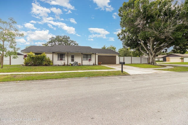813 Laurel Dr, Rockledge, FL 32955 - view of front of property with driveway, an attached garage, and stucco siding