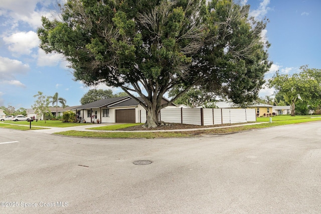 813 Laurel Dr, Rockledge, FL 32955 - view of front of house featuring a garage and a residential view